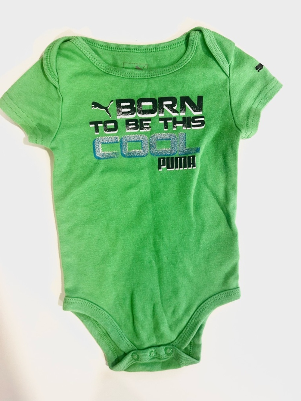 PUMA Green Baby One-Piece with 'Born to Be This Cool' Graphic